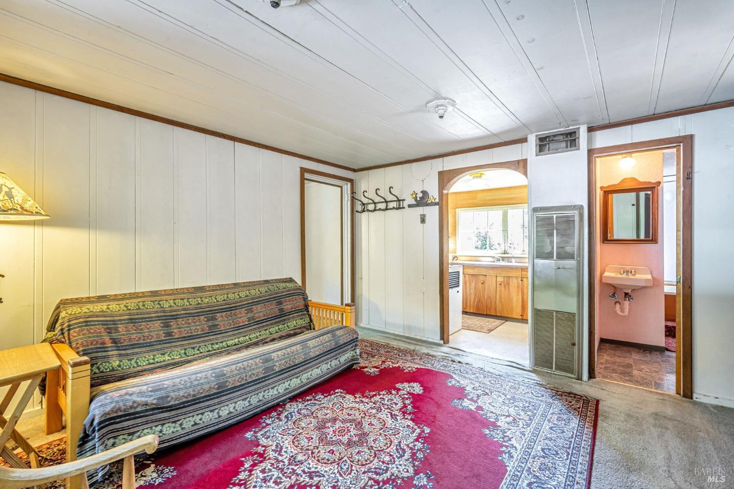 1561 South Fitch Mountain Road Healdsburg, CA 95448 - Photo 12 of 44 a bedroom with furniture and a rug