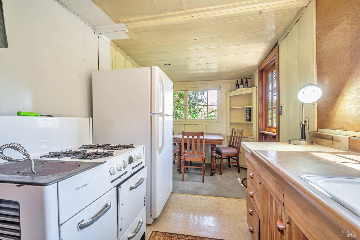 1561 South Fitch Mountain Road Healdsburg, CA 95448 - Photo 16 of 44 a kitchen with a sink stove and cabinets