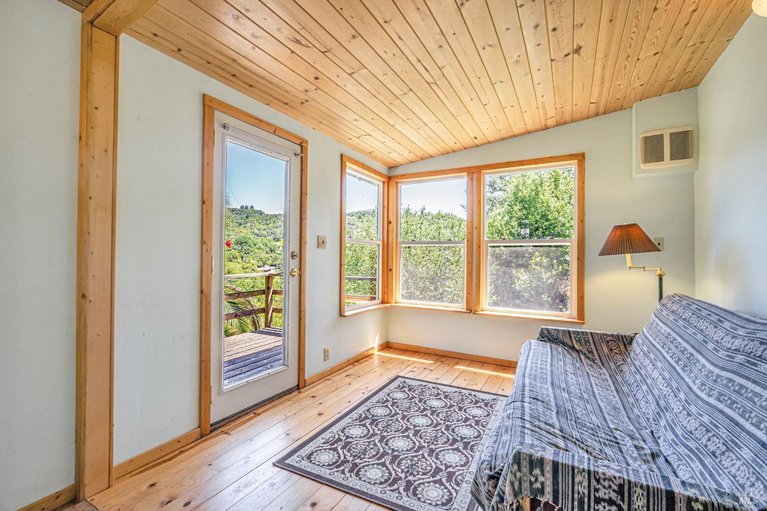 1561 South Fitch Mountain Road Healdsburg, CA 95448 - Photo 2 of 44 a view of a bedroom with wooden floor