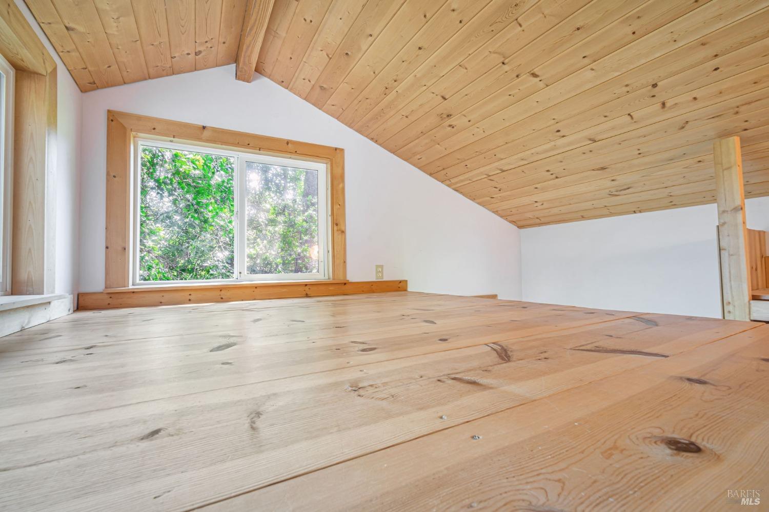 1561 South Fitch Mountain Road Healdsburg, CA 95448 - Photo 23 of 44 a view of empty room with wooden floor and fan