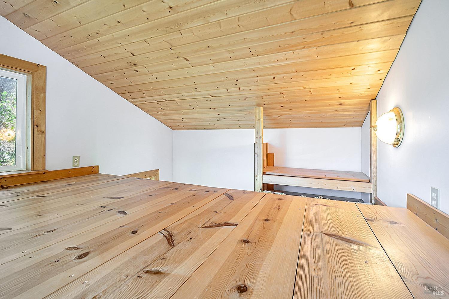 1561 South Fitch Mountain Road Healdsburg, CA 95448 - Photo 24 of 44 a view of a big room with wooden floor and windows