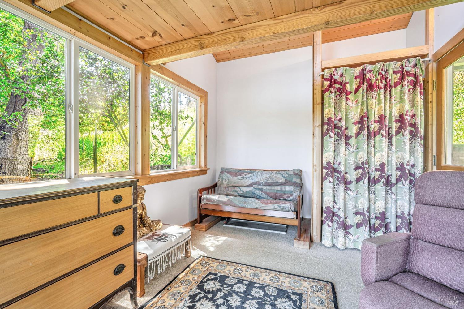 1561 South Fitch Mountain Road Healdsburg, CA 95448 - Photo 27 of 44 a living room with furniture and a window