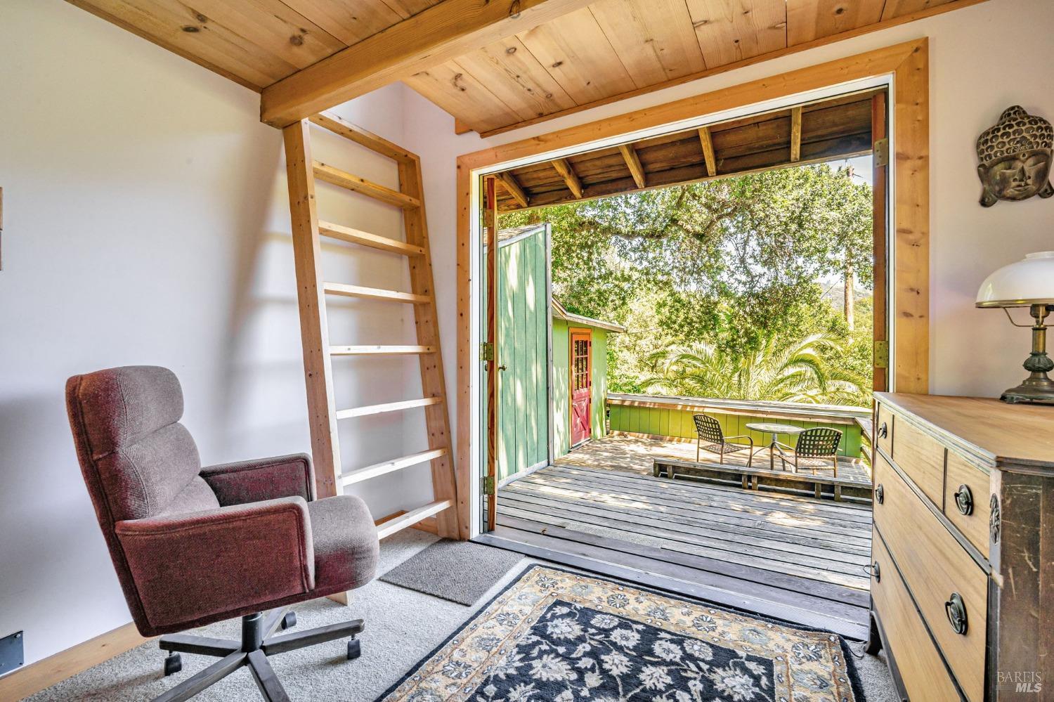 1561 South Fitch Mountain Road Healdsburg, CA 95448 - Photo 29 of 44 a bedroom with furniture and a window