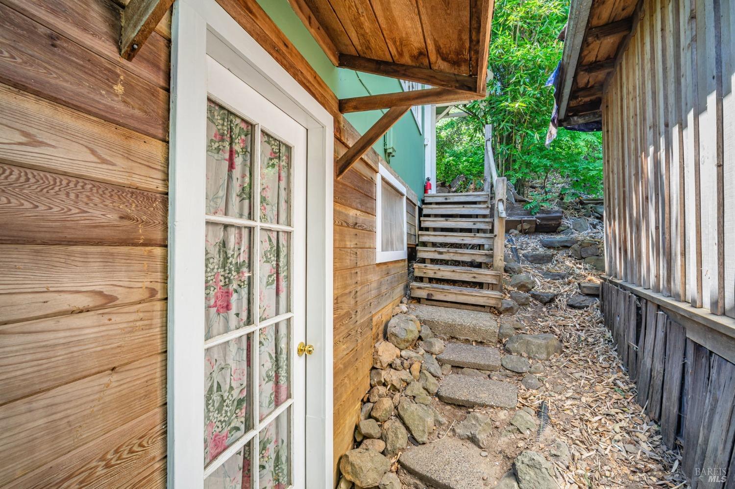1561 South Fitch Mountain Road Healdsburg, CA 95448 - Photo 38 of 44 a view of a pathway of a house with wooden floor and stairs