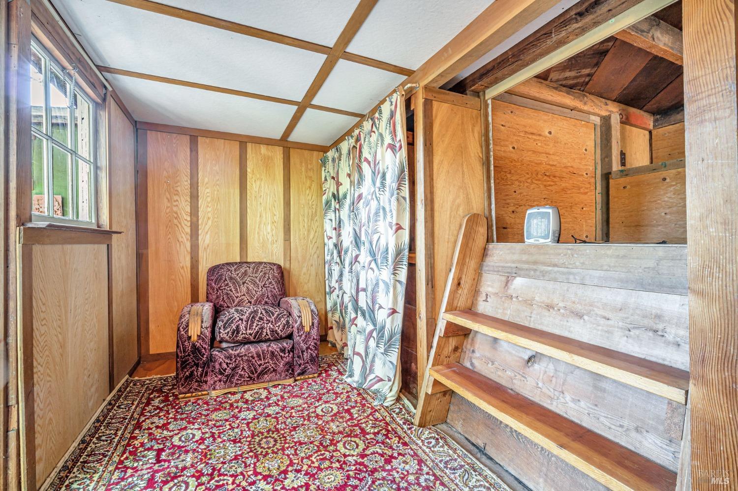 1561 South Fitch Mountain Road Healdsburg, CA 95448 - Photo 43 of 44 a living room with furniture and a rug
