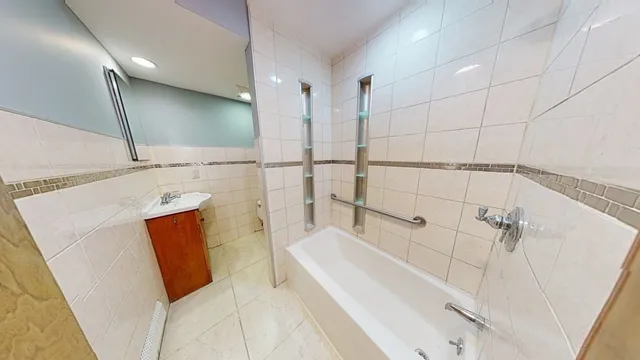 a bathroom with a bathtub and a sink