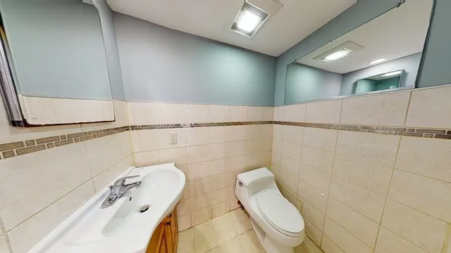 a bathroom with a shower and toilet