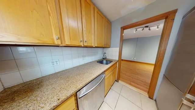 a view of a kitchen with a sink