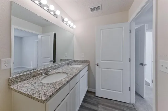 a view of room that has a white walls