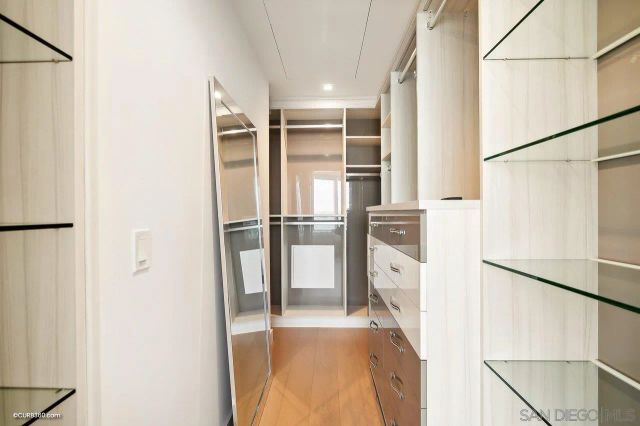 a kitchen with stainless steel appliances a refrigerator and a refrigerator