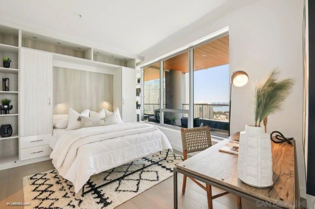 a bedroom with a bed and a table in it