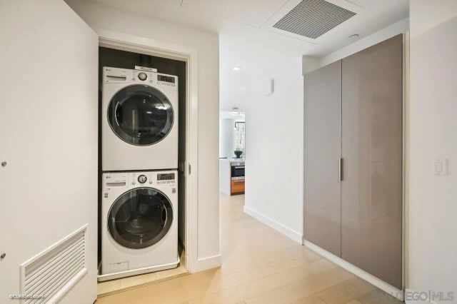 a view of a hallway with washer and dryer