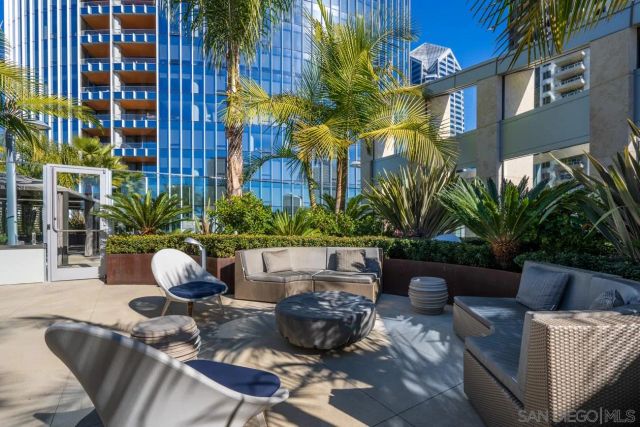a view of a chairs and table in a patio