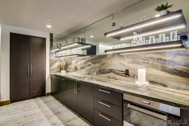 a kitchen with a sink and refrigerator