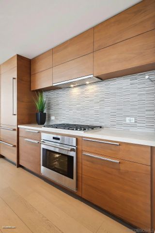 a stove top oven sitting inside of a kitchen