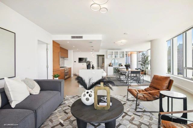 a living room with furniture and a table