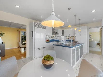 a kitchen with a table and chairs