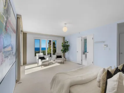 a bed room with a bed and a large window