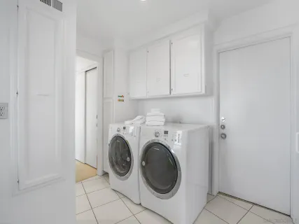 a view of storage and utility room with washer and dryer