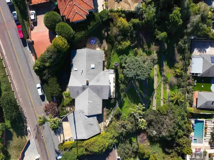 an aerial view of multiple houses with yard