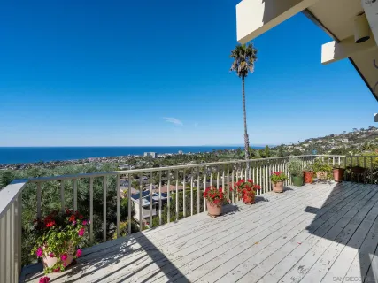 a view of a balcony with an ocean view