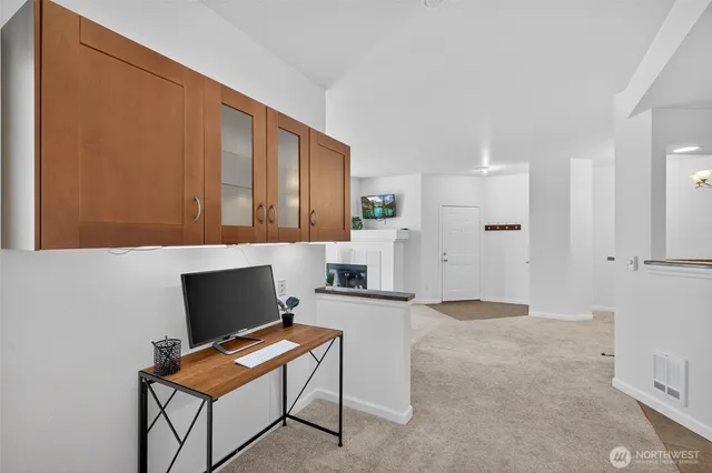 a view of a livingroom with furniture and a flat screen tv