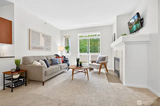 a living room with furniture and a fireplace