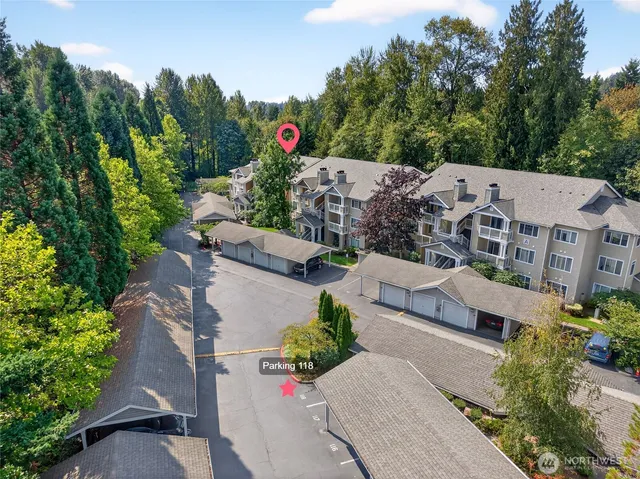 an aerial view of a house with a garden and mountain view