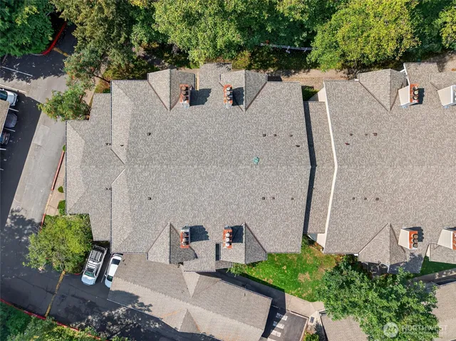 an aerial view of a house with outdoor space