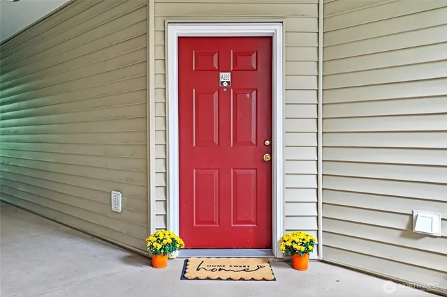 a view of front door of a house with wooden door