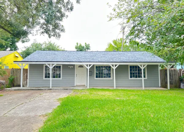 front view of a house that has a yard