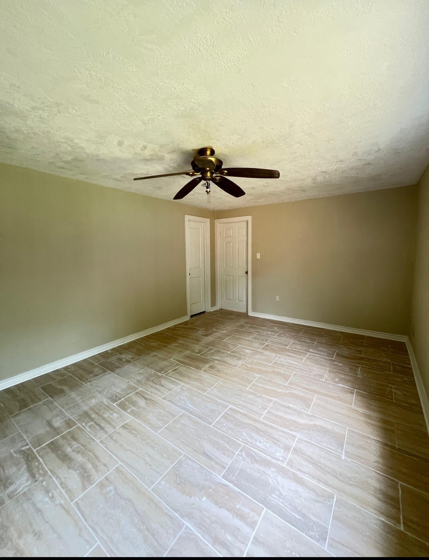 3121 Bond Street Pasadena, TX 77503 - Photo 13 of 16 a view of a room with wooden floor and ceiling fan