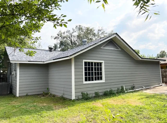 a view of a backyard of the house