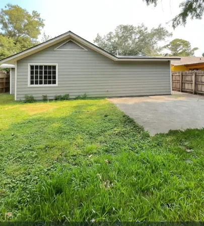 a house view with a backyard space