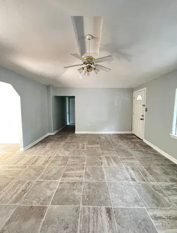 a view of an empty room with a window