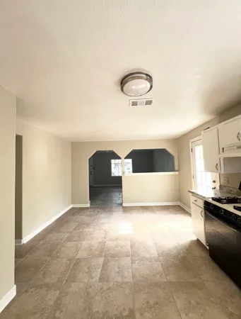 a bedroom with a bed and a sink