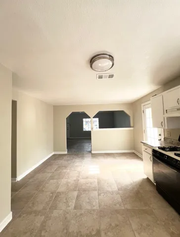 a bedroom with a bed and a sink