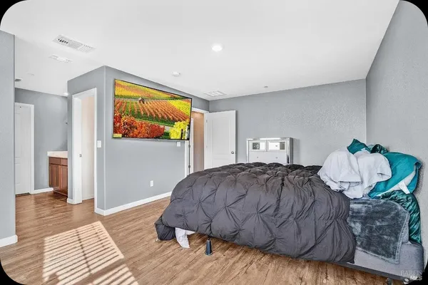 a bedroom with a bed and dresser