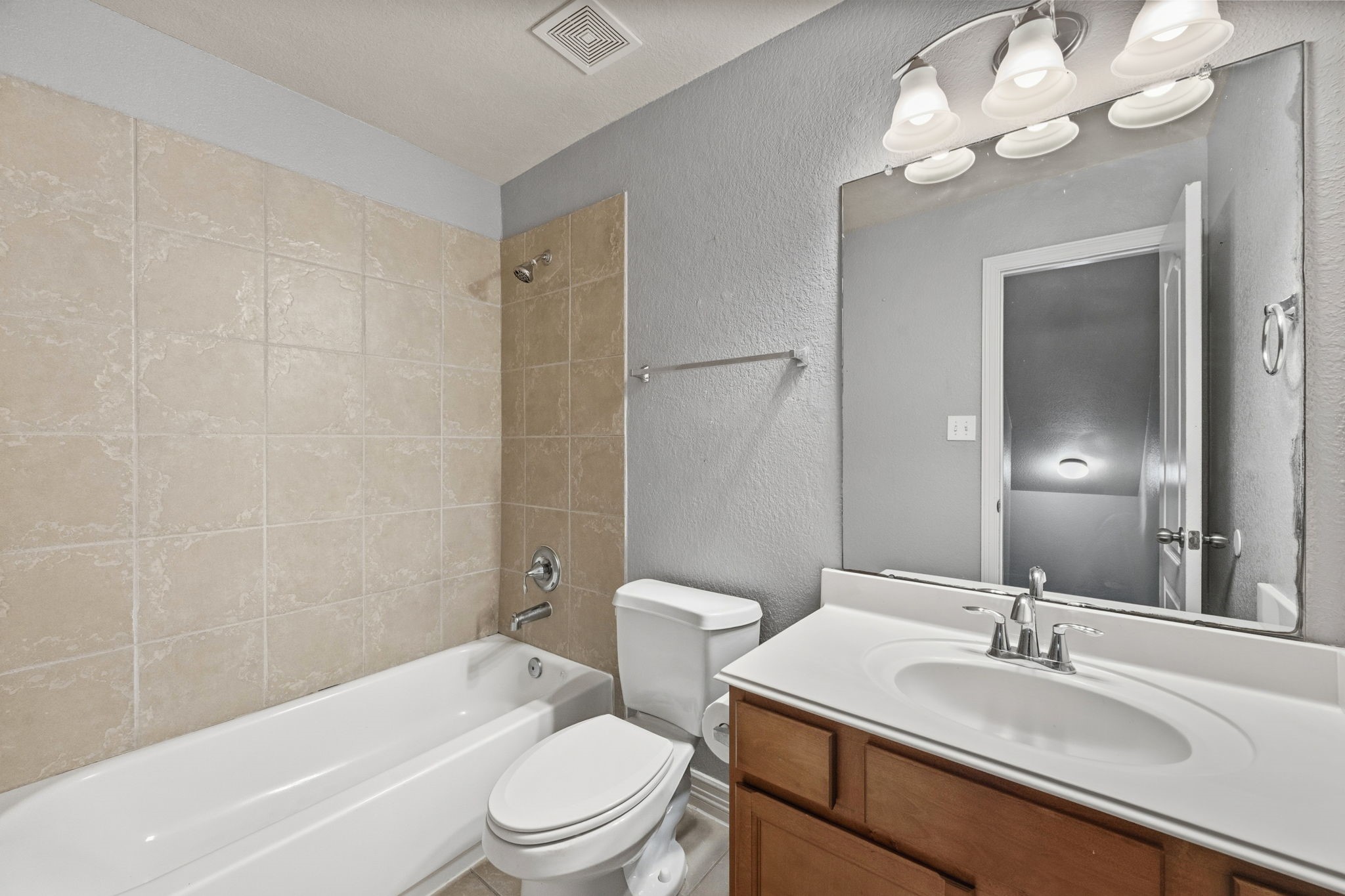 1405 Big Hill Road Winnie, TX 77665 - Photo 41 of 43 a bathroom with a sink a toilet a mirror and shower