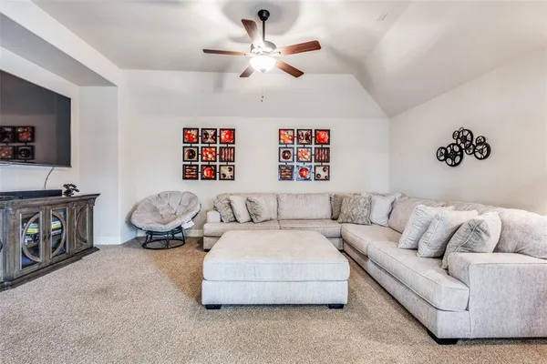 a bathroom with a granite countertop sink a toilet and shower