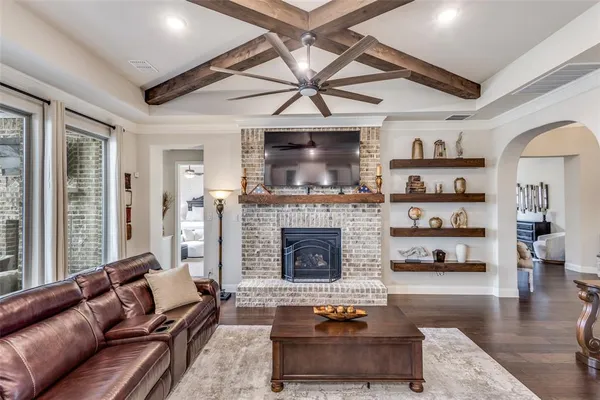 a living room with furniture and a kitchen view