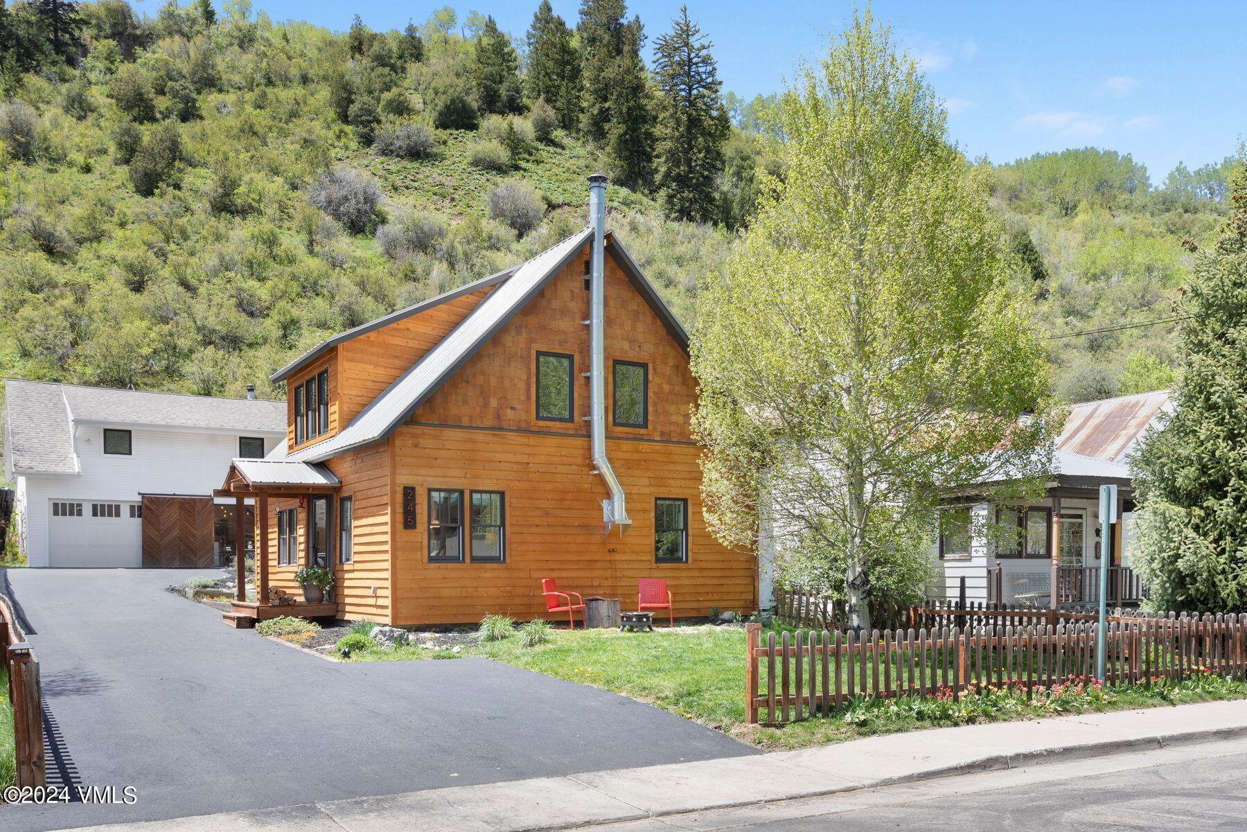 245 Pine Street Minturn, CO 81645 - Photo 1 of 44 a front view of a house with a yard