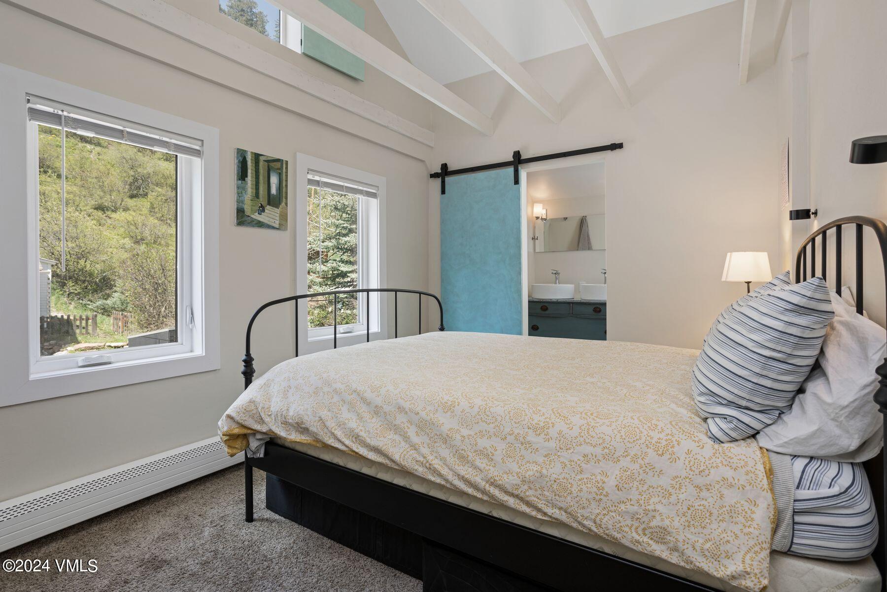 245 Pine Street Minturn, CO 81645 - Photo 13 of 44 a bedroom with a bed and a window