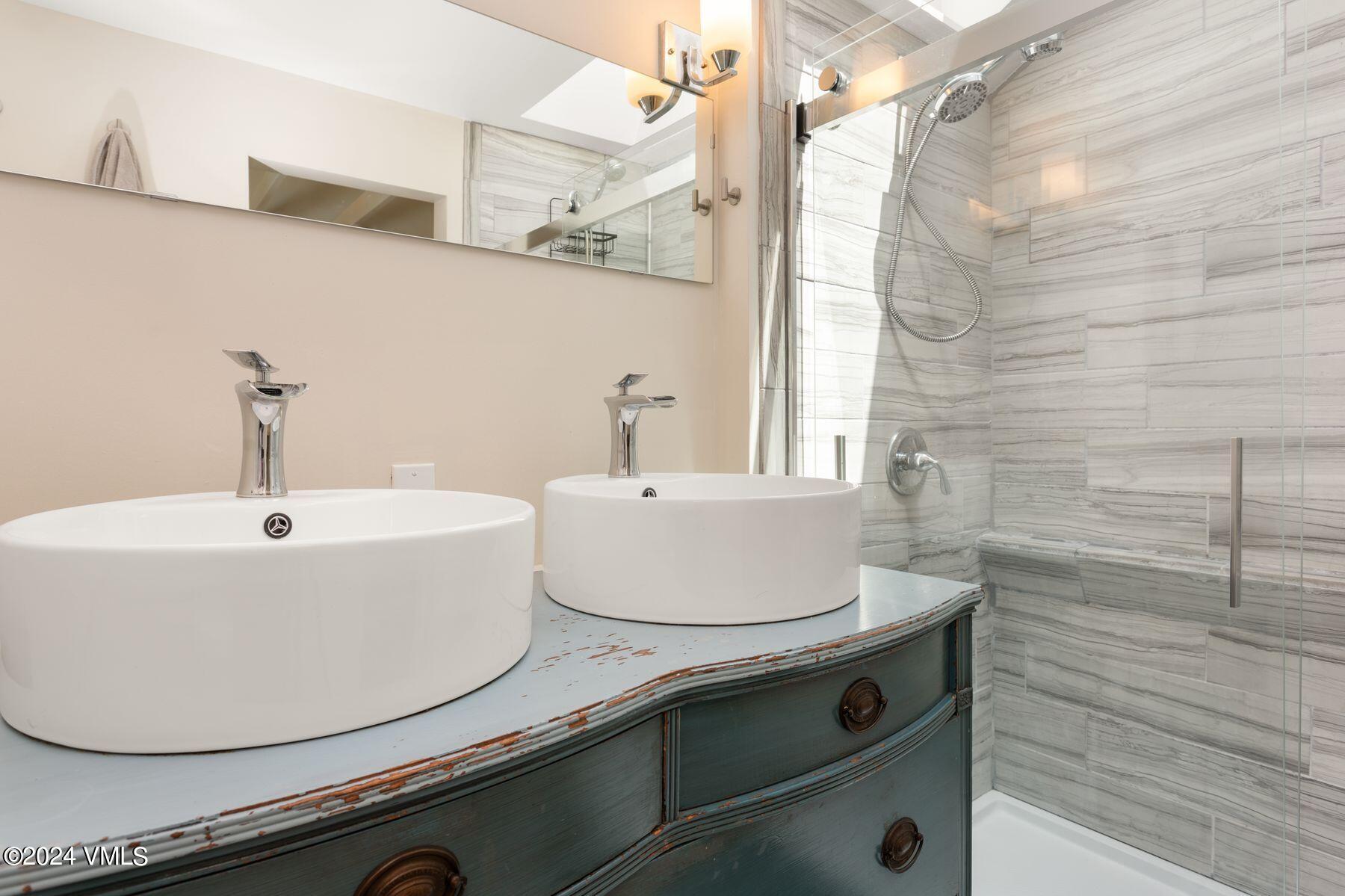 245 Pine Street Minturn, CO 81645 - Photo 15 of 44 a bathroom with a sink and a mirror