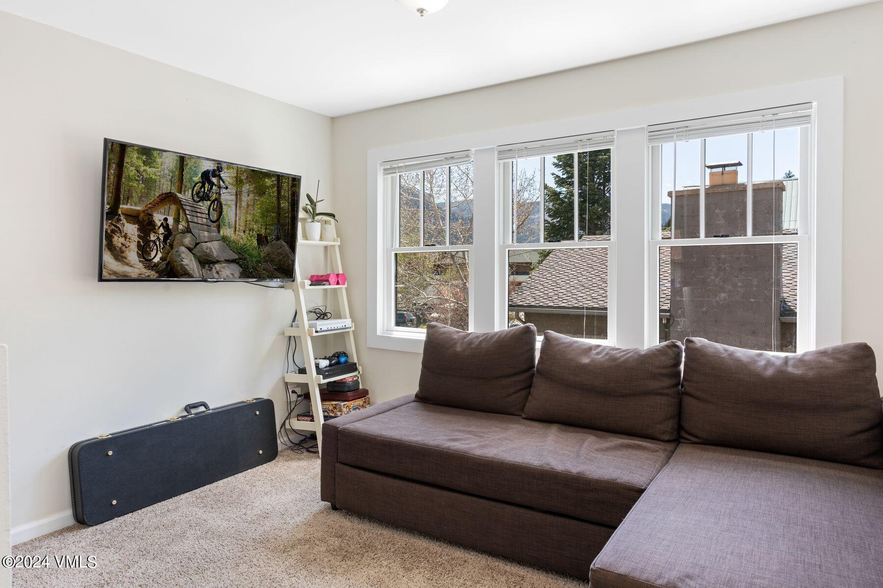 245 Pine Street Minturn, CO 81645 - Photo 16 of 44 a living room with furniture and a large window