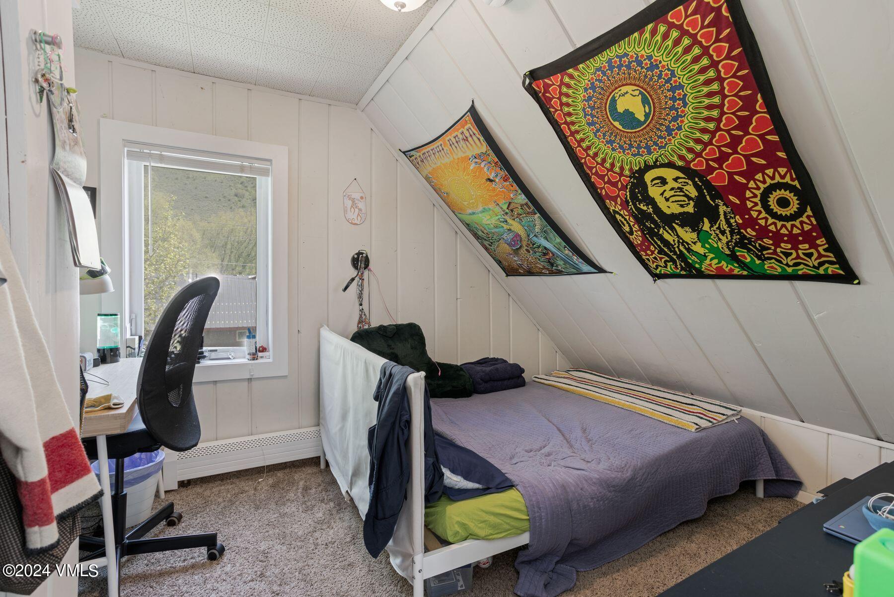 245 Pine Street Minturn, CO 81645 - Photo 19 of 44 a bedroom with a bed and furniture