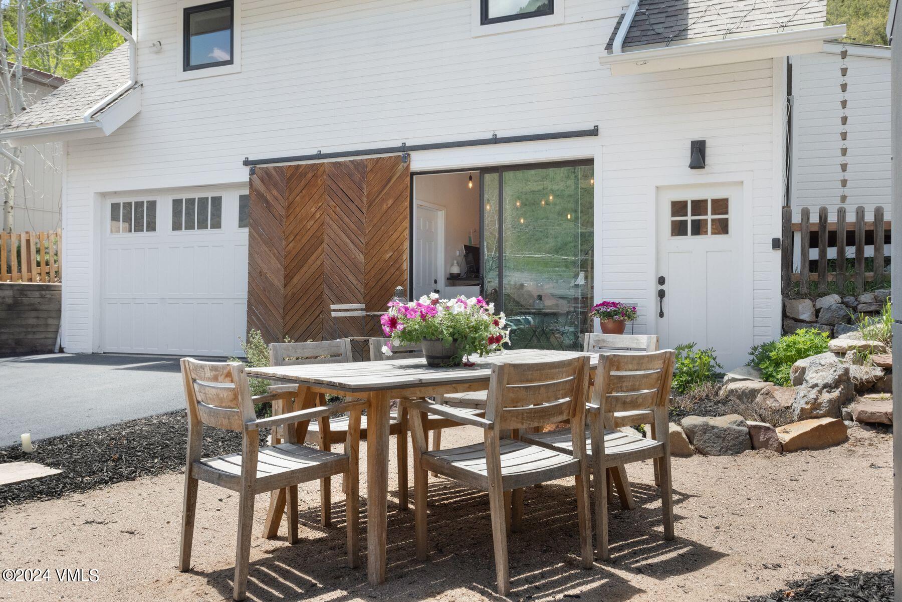 245 Pine Street Minturn, CO 81645 - Photo 27 of 44 a table and chairs in front of a house