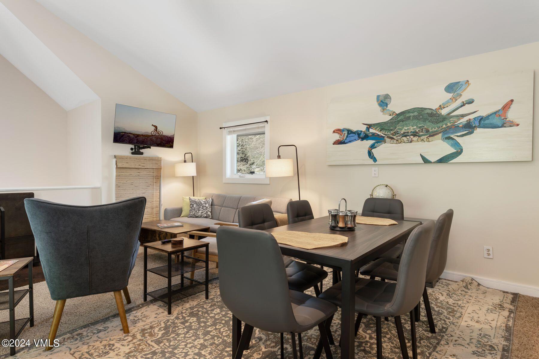 245 Pine Street Minturn, CO 81645 - Photo 30 of 44 a dining room with furniture a rug and wooden floor