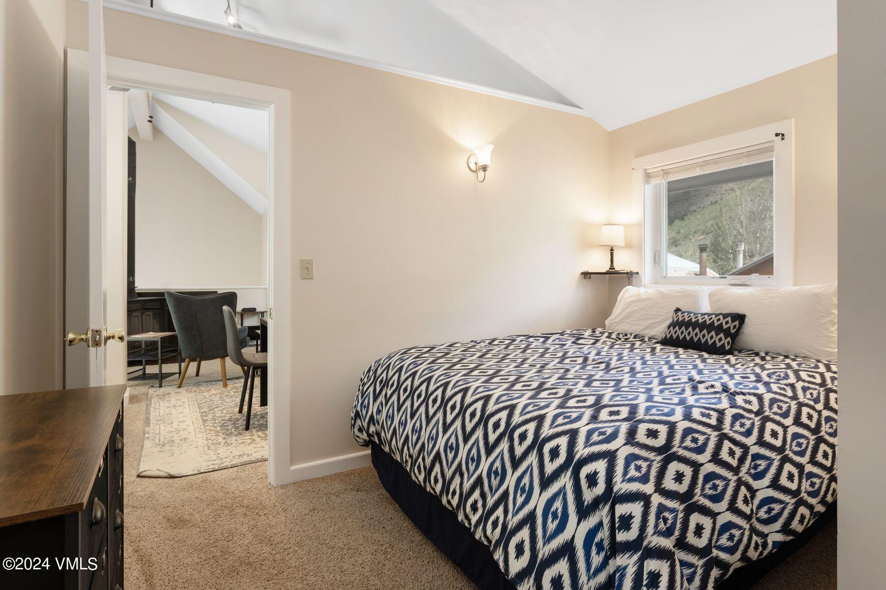 245 Pine Street Minturn, CO 81645 - Photo 35 of 44 a bedroom with a bed and wooden floor