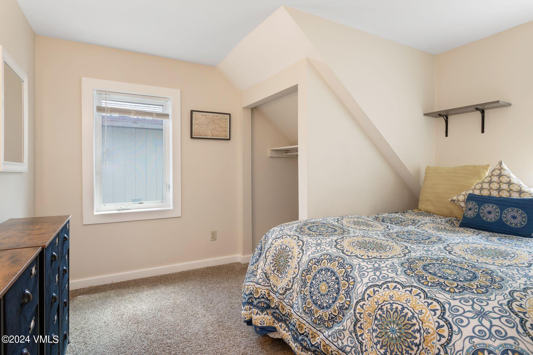 245 Pine Street Minturn, CO 81645 - Photo 36 of 44 a bedroom with a bed and a window